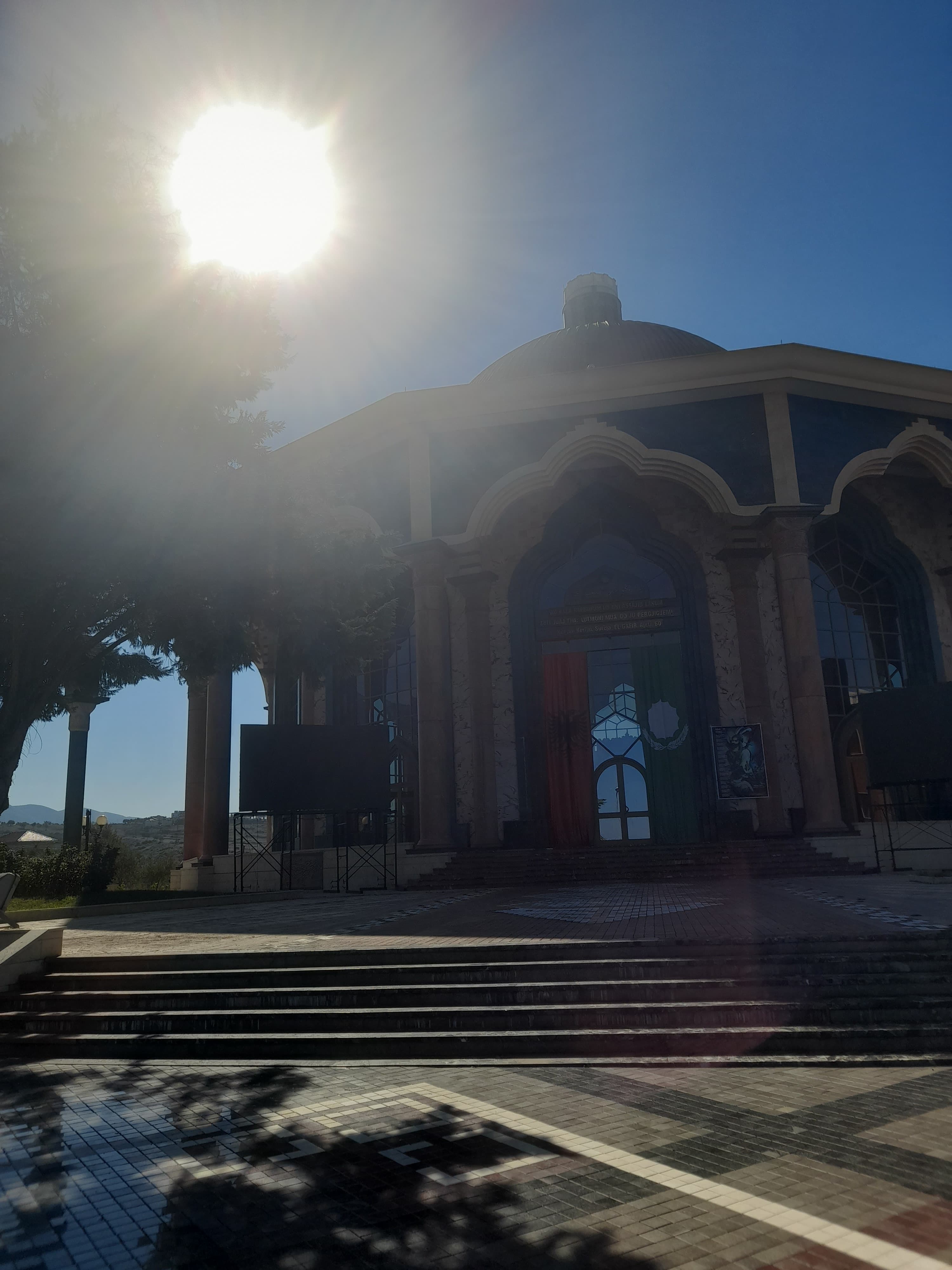 Religious architecture in Tirana beneath a bright blue sky